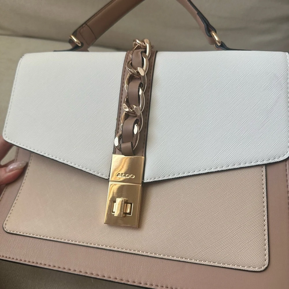 ALDO women's handbag with a top handle and chain detail.